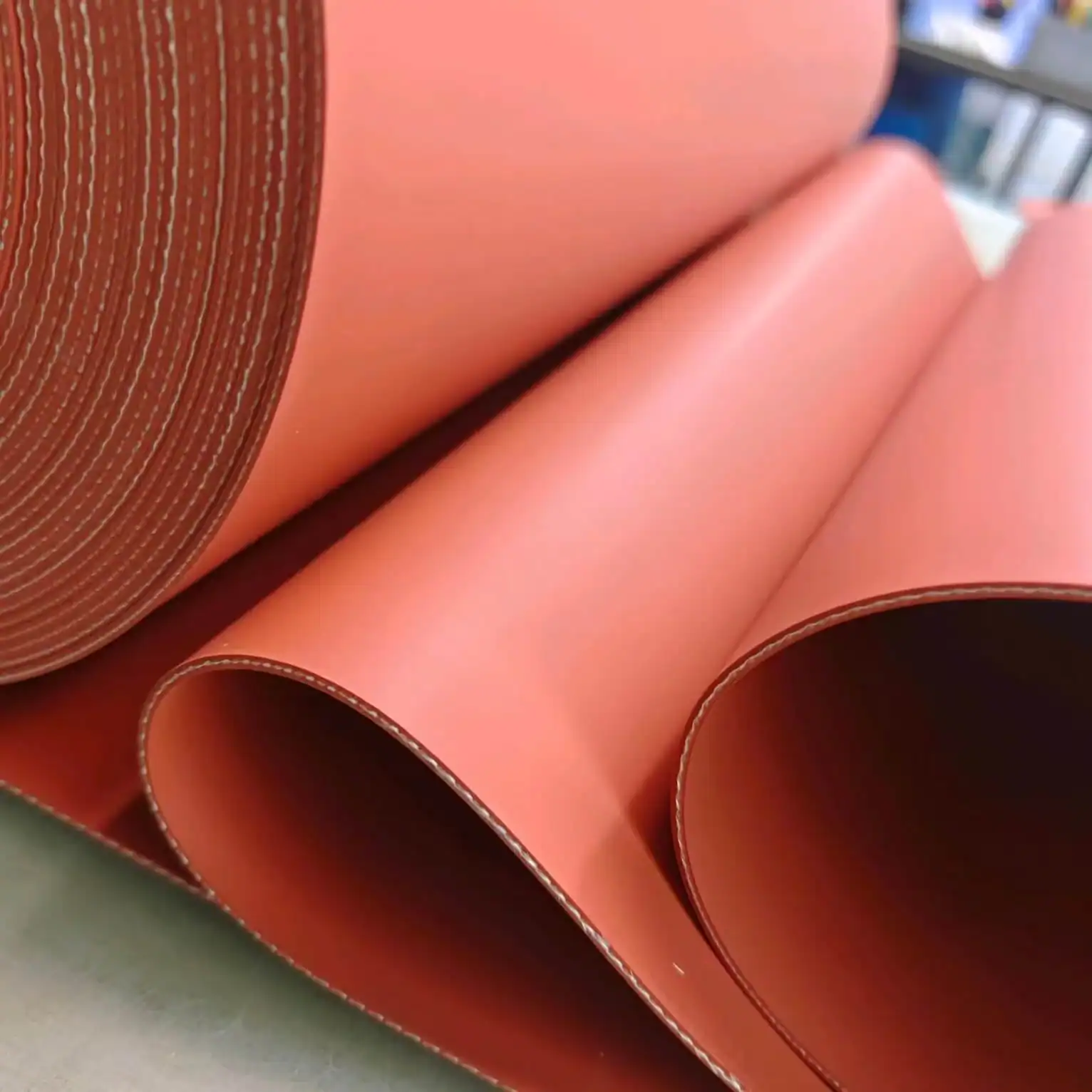 Fiberglass reinforced silicone press pad used in photovoltaic module EVA lamination