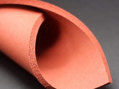 Close-up of silicone foam sheet cellular structure showing compressible and lightweight material for thermal insulation.